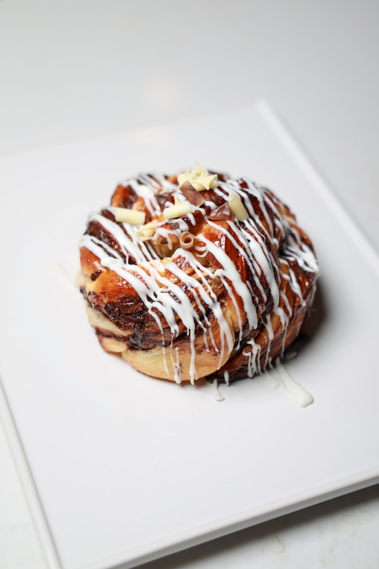 White Chocolate Twist pastry on a ceramic plate